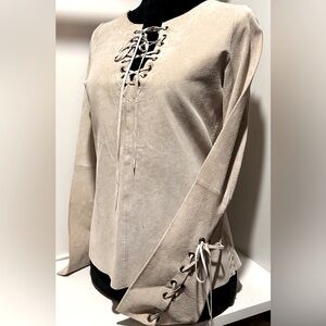 Vintage leather 70’s style top size small.  With laced up sleeves and neckline